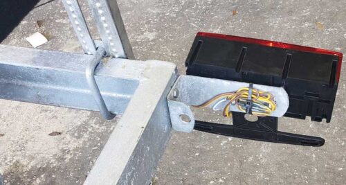 TAIL LIGHT BRACKET SHOWN WITH LIGHT ON TRAILER